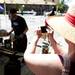 Grand Rapids resident Betsy Anderson photographs James Viste as he forges iron during the Ann Arbor Art Fair on South University Avenue on Saturday, July 20. She has attended the art fair on and off for the last 37 years. Daniel Brenner I AnnArbor.com